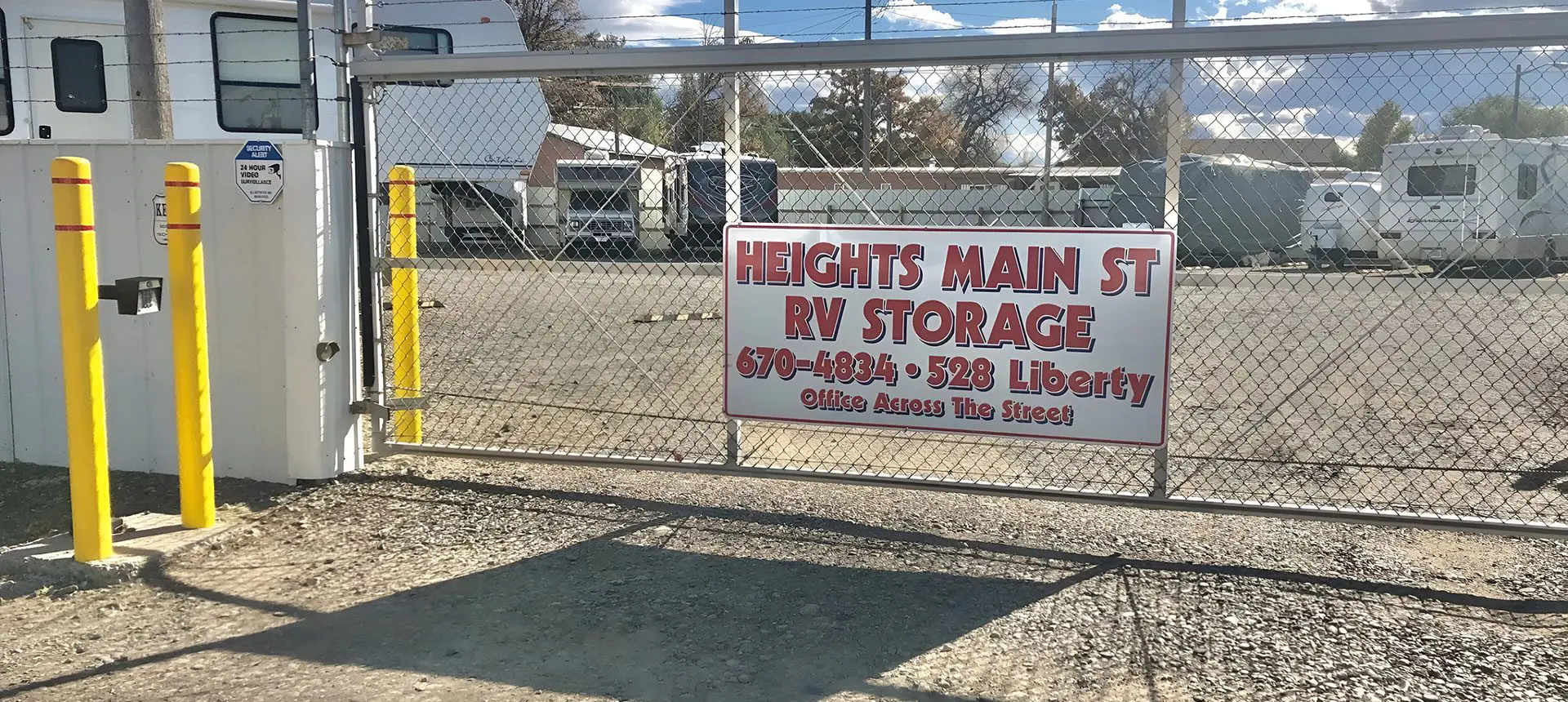 A sign is posted on the side of a fence.