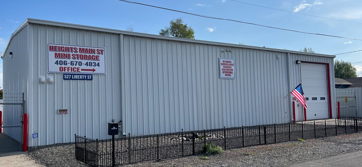 A fence is shown next to a building.